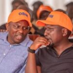 Amisi Calls Out Ichung’wah Over ODM Cap Photo, Demands Swift Action from UDA Amisi Calls Out Ichung’wah Over ODM Cap Photo, Demands Swift Action from UDA